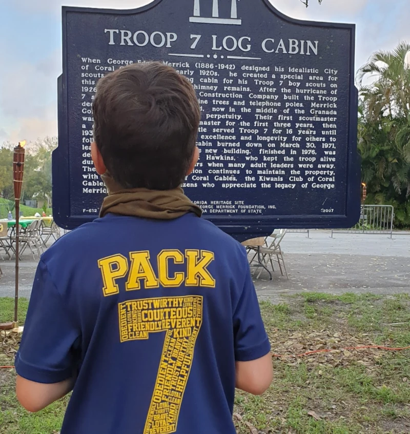 Cub reading historic marker sign