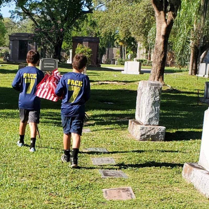 Placing flags in cemetery for Memorial Day