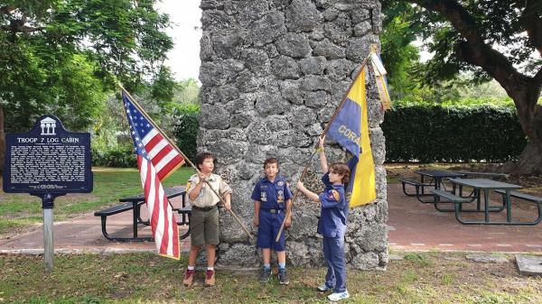 Cub Scouts in front of chimney